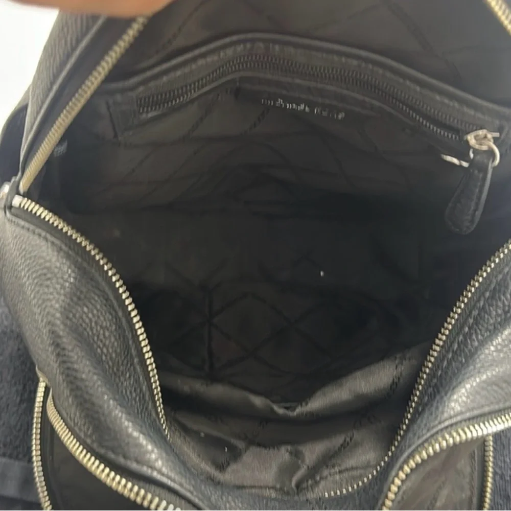 Michael Kors Rhea Medium Backpack in black pebbled leather  silver-tone dust bag